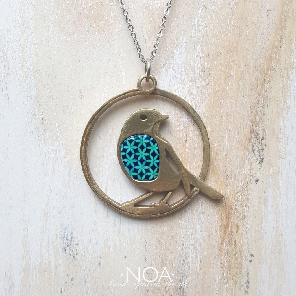 https://www.noajewellery.com/range/robin-pendant-brass-and-ceramic-on-a-chain/