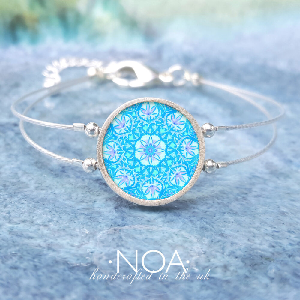 A151 (37) Light Blue & Purple Flower